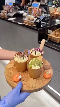 Enjoying eco-friendly Cookie Cloud Cups filled with delicious coffee flavors at Ovis Coffee in London.