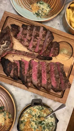 Delicious brisket croquettes and T-bone steak at Kindling Restaurant, Brighton, showcasing grass-fed British meat.