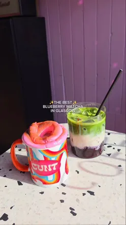 Enjoying a delicious Blueberry Matcha drink at Rude Cookies in Glasgow, topped with homemade blueberry syrup.