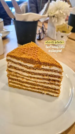 Delicious honey cake layers from Pavlova Bake & Cake, a cozy Glasgow cafe perfect for groups on weekends.