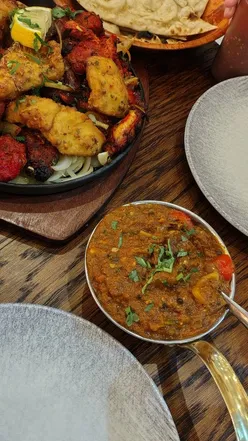 Interior of The Pendulum Pub in Pendeford, Wolverhampton, featuring modern decor and a selection of mixed grills.