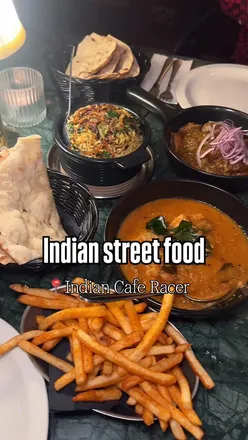Delicious array of Indian dishes, including Mango Fish Curry, at Indian Café Racer in Birmingham's new location.