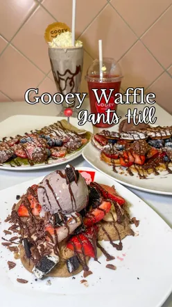 Delicious late-night desserts featuring waffles, crepes, and cookie dough with ice cream and toppings at Gooey Waffle.