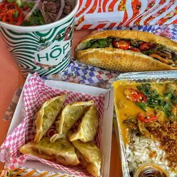 Colorful dishes from HOP Vietnamese showcasing healthy, flavorful options like lemongrass chicken and caramel chicken banh mi.