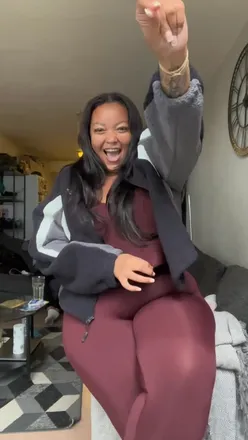 Confident person in Gymshark outfit, embracing body positivity and style, sharing fashion tips and self-love message.