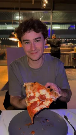 Unlimited pizza slices at SanCo Pizza in Newcastle’s The Forge, featuring a vibrant dining atmosphere.