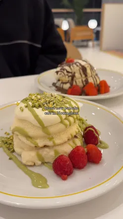 Soufflé pancakes with Nutella, strawberry, pistachio, and raspberry at Fluffy Fluffy UK, Nottingham.