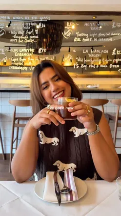 Diners enjoying vibrant dishes at Belly Bistro, a modern Filipino eatery in Kentish Town, London.