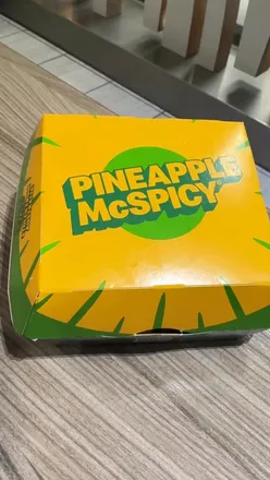 Delicious Pineapple McSpicy with crispy chicken, bacon, cheese, and fresh pineapple in a toasted sesame bun.