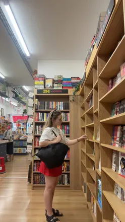 Solo explorer enjoying a sunny day in Muswell Hill with coffee, charity shopping, and knitting in the park.