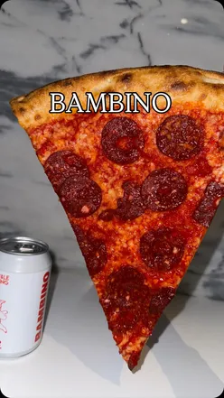 Delicious vegan hot pepper and cheese pizza at Bambino Dublin, paired with their own branded beer.