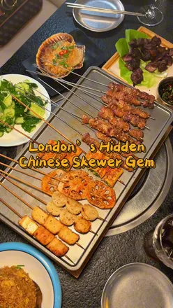 Delicious Chinese skewers and hotpot at Mr Charcoal near Waterloo, London, offering flavorful beef, lamb, and enoki mushrooms.