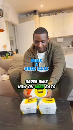 Relaxing with Bims chicken from Uber Eats after a hectic London workday on the sofa – perfect comfort food moment.