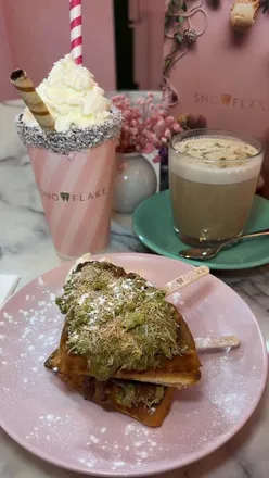 Indulgent dessert at Snowflake Gelato in Soho: waffle sticks, spiced pistachio latte, and creamy milkshake delight.