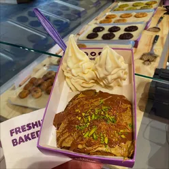 Excited customers at the new My Cookie Dough opening in Bath, enjoying delicious cookie dough treats and ice cream.