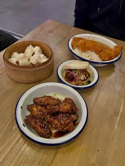 Delicious dishes at Hello Oriental: Char Siu Bao, Duck Bao Buns, Teriyaki Wings, and Chicken Katsu Curry.
