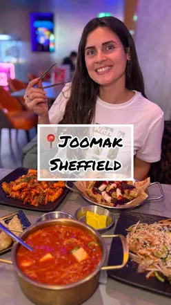Colorful Korean dishes at Joomak in Sheffield, featuring tteokbokki, japchae, and a vegan menu. A vibrant dining experience!