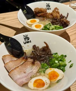 Sister enjoying signature paitan ramen at Umi, Shandwick Place, Edinburgh on a chilly day.