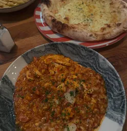 Delicious pollo risotto, spaghetti Alfredo, and pollo Marsala at Amici, a top North Coast restaurant.