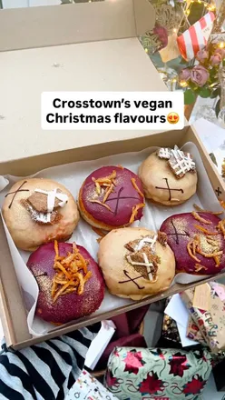 Vegan Christmas doughnuts from Crosstown: Gingerbread Caramel and Spiced Pear & Cinnamon, beautifully presented for the holidays.