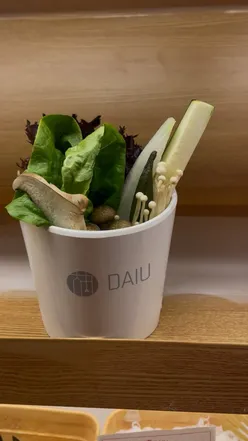 Veggie spread with shiitake mushrooms and tofu at Ofc Daiu, a vibrant hotpot spot with DIY dipping sauce station.