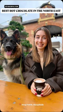 Enjoying Gochujang Caramel hot chocolate at Deep North in Sunderland, a top spot for festive drinks and delicious doughnuts.