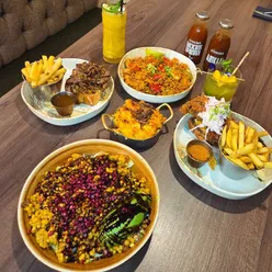 Delicious African-fusion dishes and vibrant mocktails at Afrikana on Wilmslow Road, Manchester, with welcoming decor.