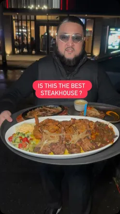 Enjoying the Sahara Feast at Sahara Grill, a top halal steakhouse in Sparkbrook, Birmingham.