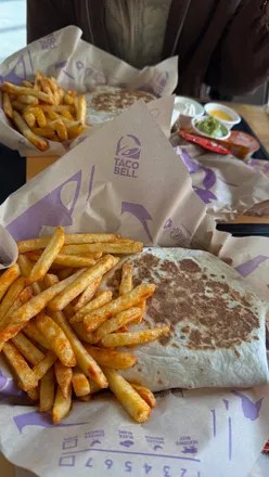 New Taco Bell menu items in Sheffield: Triple Layered Crunchwrap, Firecracker Chicken Slider, and Caramel Apple Empanada.