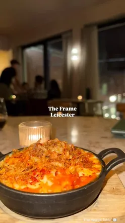 Delicious pitta and dips enjoyed at The Frame in St Martins Square, Leicester, showcasing a vibrant dining experience.