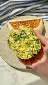 Egg and avocado chopped salad wraps, perfect for meal prep and packed with protein, ideal for quick, nourishing meals.