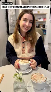 Hot chocolate with whipped cream at Lagom Coffee Bar, a cozy gem in Newcastle with a Scandi vibe.