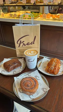 Cozy interior of Fred's Bakery's new London location with pastries and coffee, perfect for relaxed mornings and coffee dates.