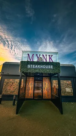 Mocktails and succulent lamb chops at Mynk Steakhouse in Bradford, enjoying delicious flavors and a vibrant atmosphere.