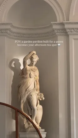 Enjoying afternoon tea in a regal garden pavilion at The Orangery, Kensington Palace, perfect for a royal experience.