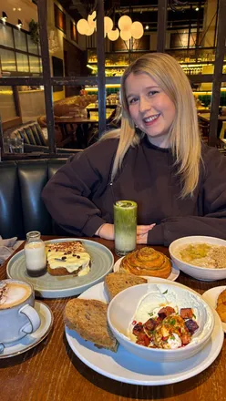 Brunch at Medicine Bakery in Birmingham featuring Tiramisu French Toast and Turkish Eggs with chorizo on a snowy day.