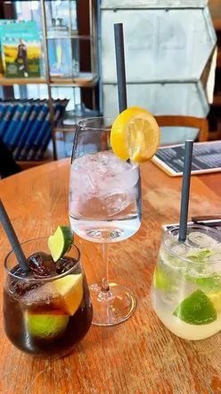 Cozy interior of Aux Bon Vivant, a French cafe in Sheffield, featuring coffee and freshly baked pastries.