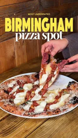 Delicious pizza served at Alicia Microbakehouse, Birmingham's hidden gem with unique toppings and cozy atmosphere.