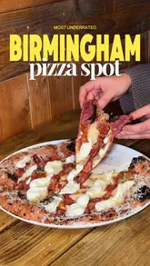 Delicious pizza served at Alicia Microbakehouse, Birmingham's hidden gem with unique toppings and cozy atmosphere.