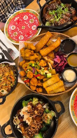 Delicious dishes at Mans Market in Leeds, showcasing the January special: 50% off all mains, grains, and noodles!