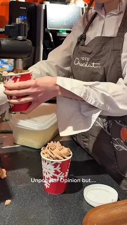 Enjoying hot chocolate at Hotel Chocolat in Market Harborough on a snowy day, with a delightful chocolate cream.