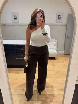 A cozy date night featuring pasta and pizza with drinks, perfect for a casual outing.