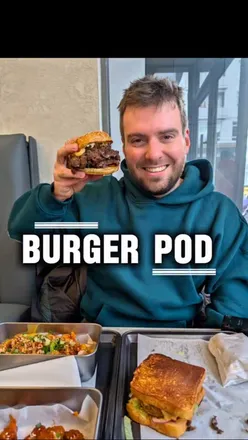 Delicious Quad Smash Burger with four patties, spicy chicken sando, loaded fries, and chili cheese bites at Burger Pod UK.