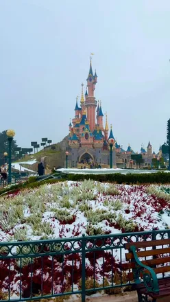 Disneyland Paris beautifully blanketed in snow, showcasing the magical castle in January 2026.