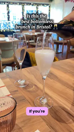 Guests enjoying bottomless brunch at @tablefive_cappadocia in Bristol with drinks and delicious food offerings.