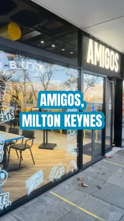 Burger and shake feast at Amigos Burgers in Milton Keynes, featuring buttermilk chicken and a tasty Skittles shake.