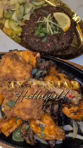 Authentic Punjabi dining at My Punjab, Huddersfield, featuring mixed grill, biryani, and cozy emerald-green decor.