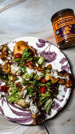 Homemade Chicken Tikka Masala with mint raita, featuring Aagrah Foods sauce, perfect for quick weeknight dinners.