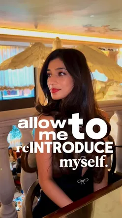 Preksha enjoying delicious food in London, capturing moments as an international student and food blogger.