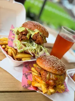 Fried chicken lovers enjoy award-winning buttermilk chicken burgers at Clucking Oinks in St James' Stack, Newcastle.